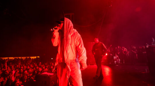 Members of the band Kneecap including Mo Chara and Moglai Bap perform onstage during Day 1 of Coachella